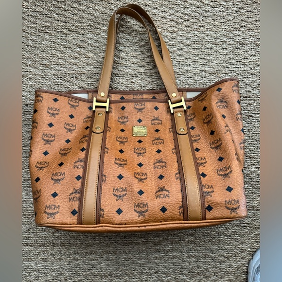 MCM Handbags - MCM Cognac Visetos Monogram Tote with Gold Hardware